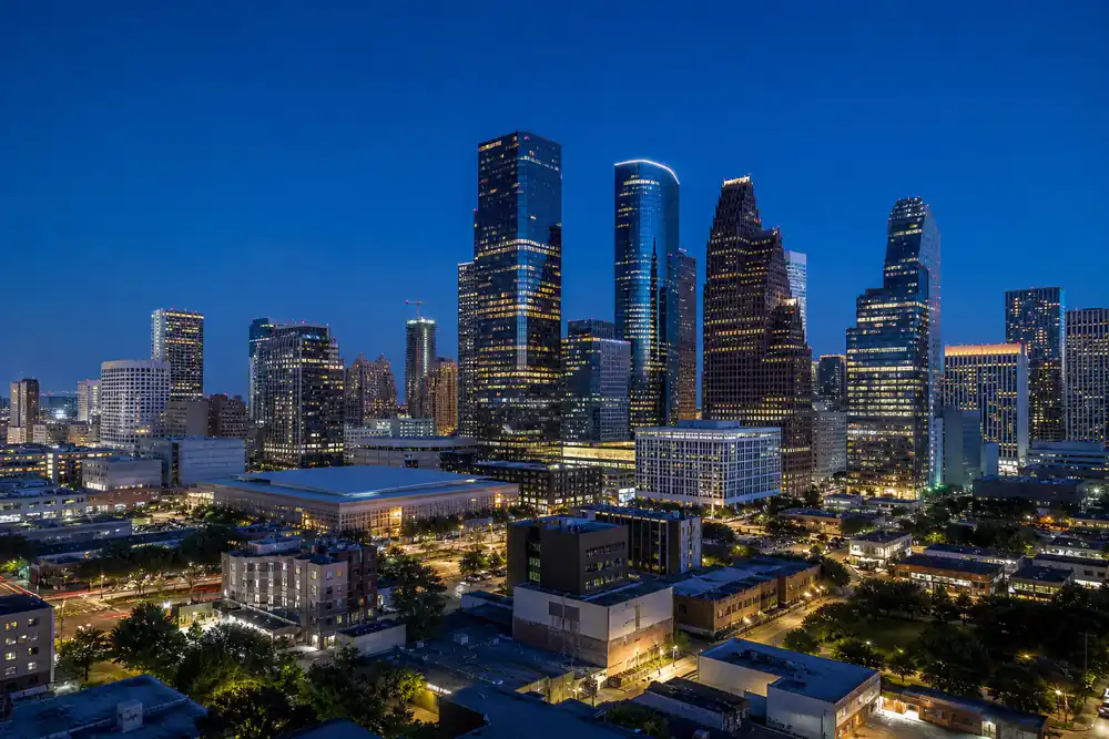 Downtown Houston skyline at dusk, the service area for Strive HVAC & Construction