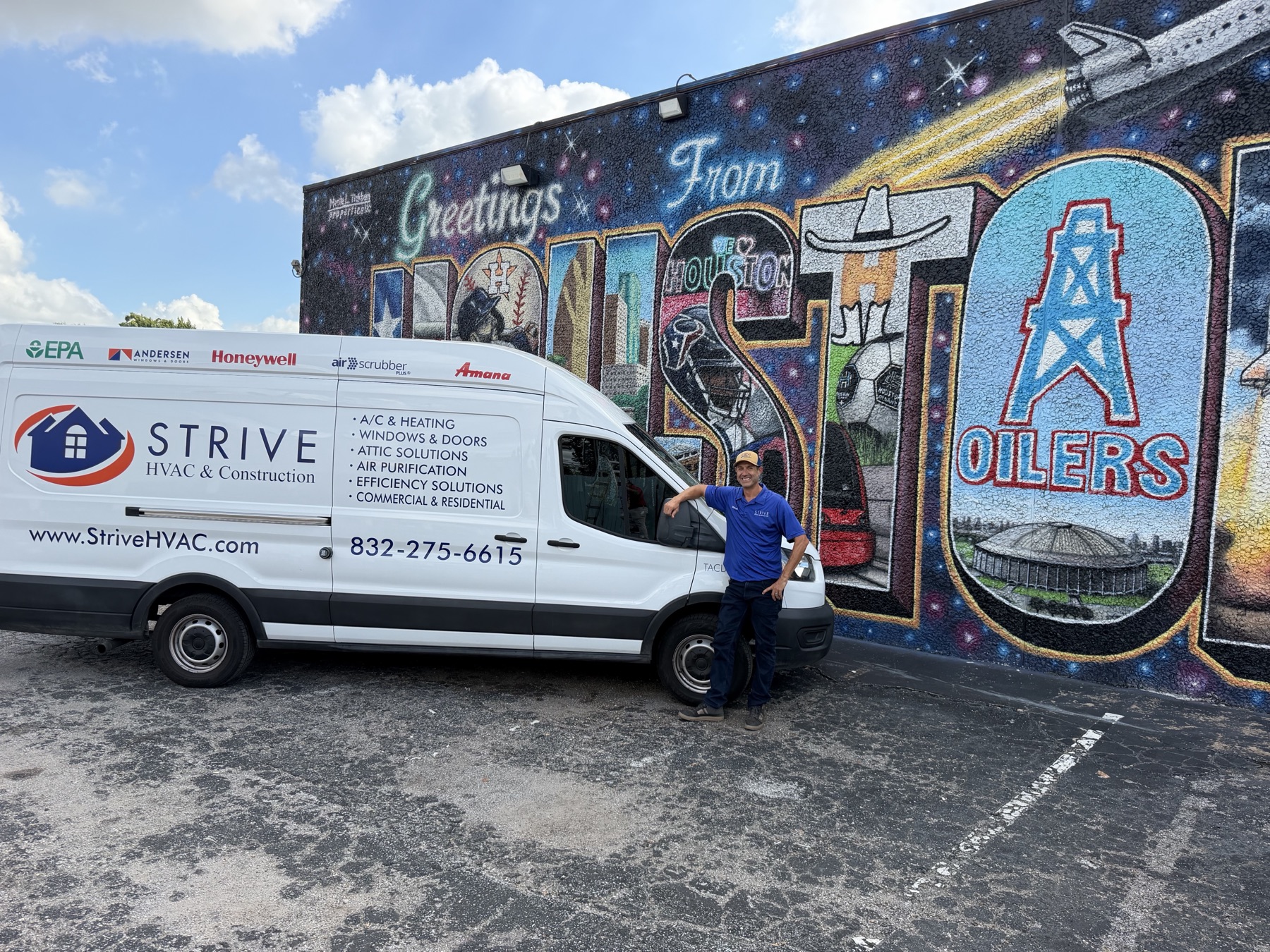 Strive HVAC & Construction van in front of Houston's Greetings From Houston mural